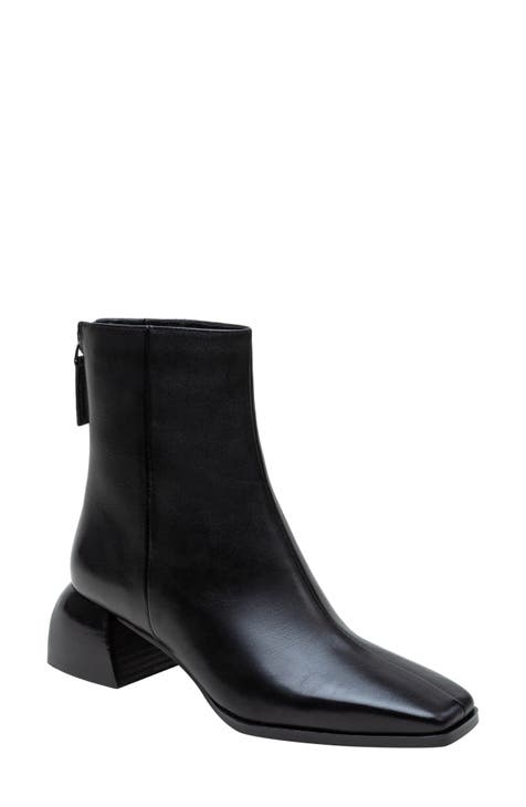Black ankle boots with rectangular heel and square toe with gold detail