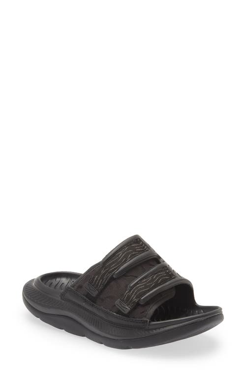 Shop Hoka Gender Inclusive Ora Luxe Slide Sandal In Black/black