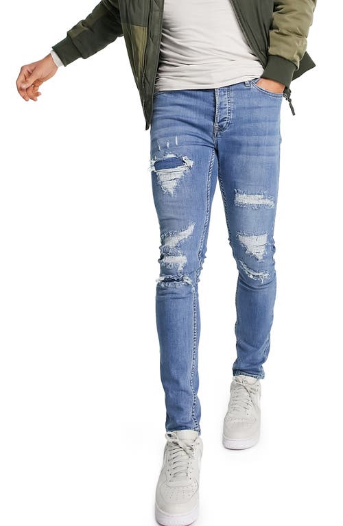 Topman Rip and Repair Skinny Jeans in Mid Blue