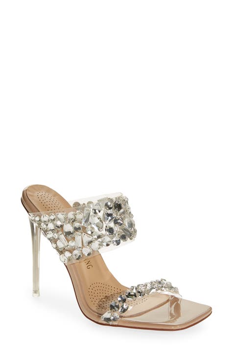 Beautiful Silver Glitter High Heel Female Shoes On Glass Shelf