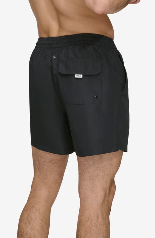 Shop Dkny Core Solid Swim Trunks In Black