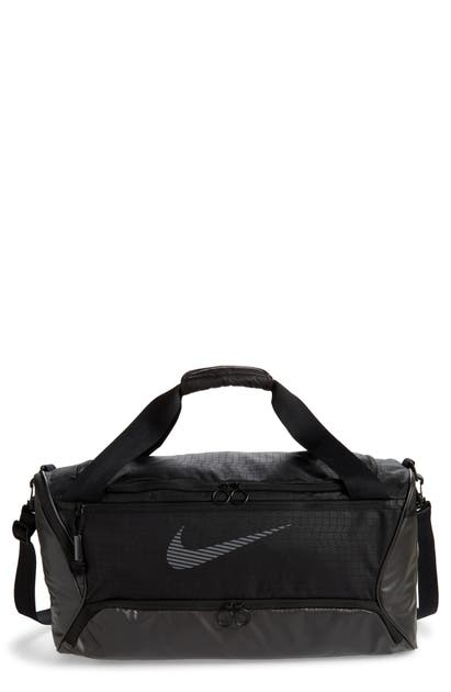 Click to view more detailed imagery on our partner's website Nike Brasilia Duffle Bag In Black/ Black/ Reflective
