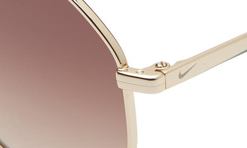 Shop Nike Ascendant 57mm Tinted Aviator Sunglasses In Gold/cargo Khaki/brown Grad