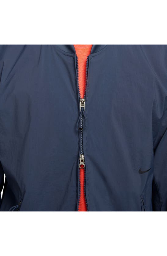 Shop Nike A.p.s. Repel Packable Bomber Jacket In Thunder Blue/ Black