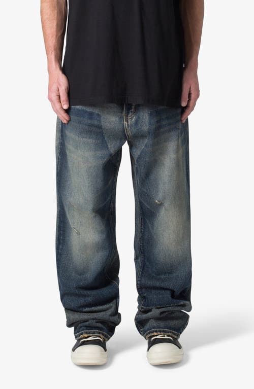 Shop Mnml Ultra Baggy Distressed Jeans In Washed Light Blue