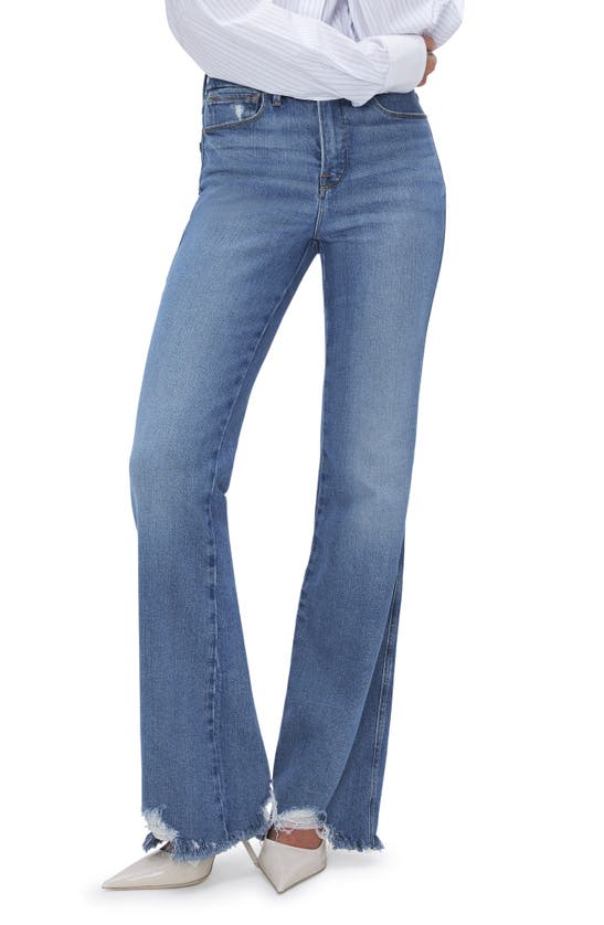 Shop Good American Good Curve Chew Hem Bootcut Jeans In Indigo631