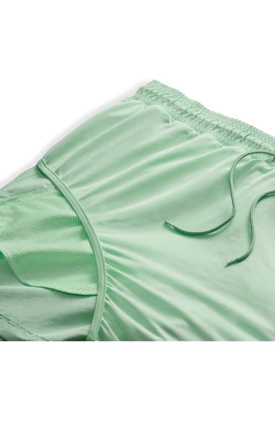 Shop Nike Acg Reservoir Goat Water Repellent Hybrid Shorts In Vapor Green/ Summit White