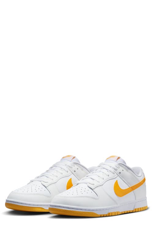 Nike Dunk Low Retro Basketball Shoe In White/university Gold/white