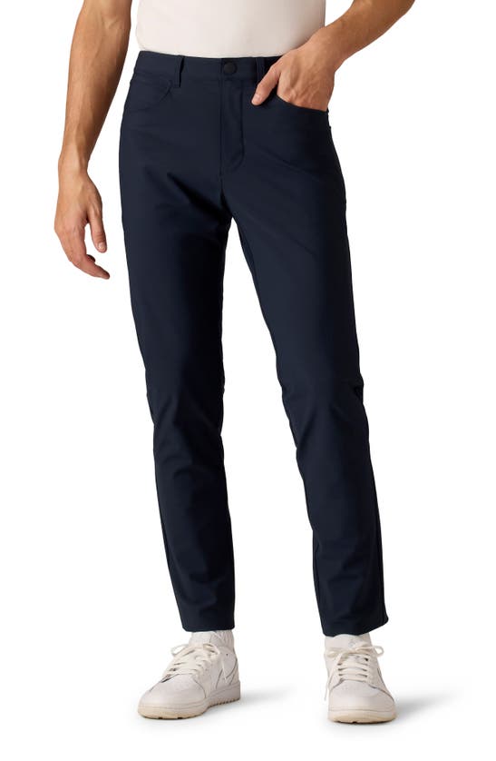 Shop Rhone Momentum Water Repellent Flat Front Golf Pants In True Navy