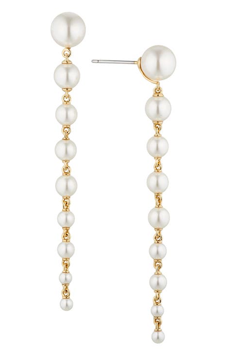 Collection of faux pearl and 'Paris Souvenirs' charm costume jewelry