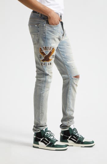 AMIRI Varsity Eagle Logo Ripped Skinny Jeans