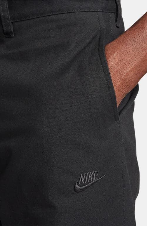 Shop Nike Club Flat Front Straight Leg Chinos In Black/black