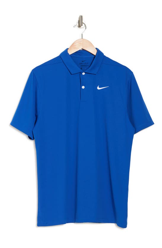 Shop Nike Dri-fit Essential Solid Polo Shirt In Game Royal/white