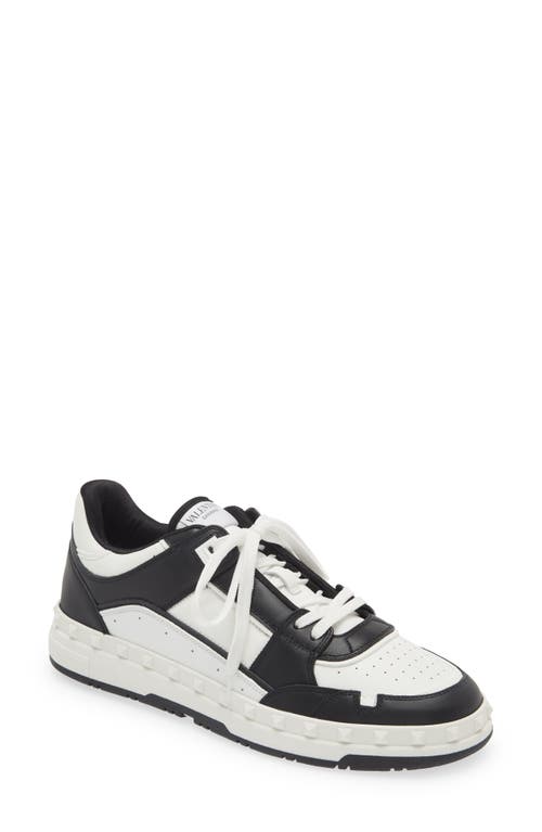 Shop Valentino Garavani Rockstud Low Top Sneaker In Bianco/nero