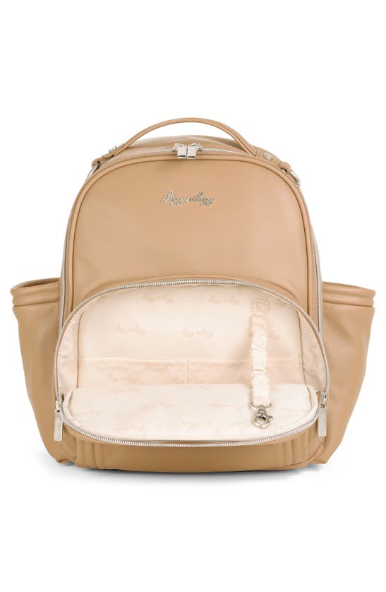 Shop Itzy Ritzy Mini Plus Diaper Backpack In Tan