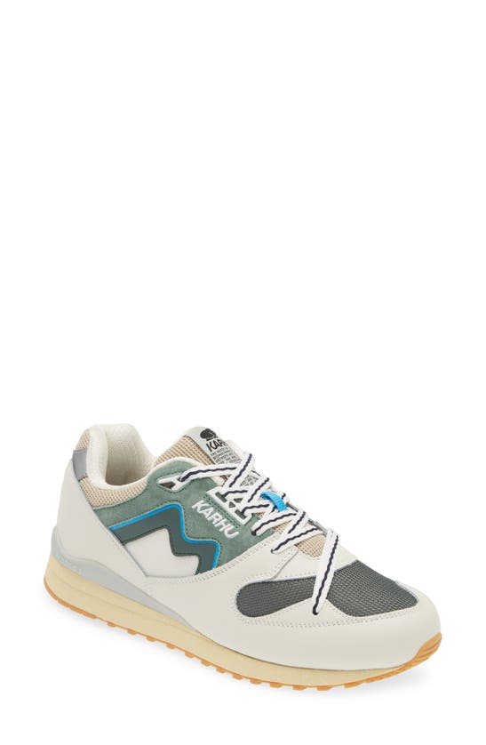 Shop Karhu Gender Inclusive Synchron Classic Sneaker In Lily White/ Forest Green