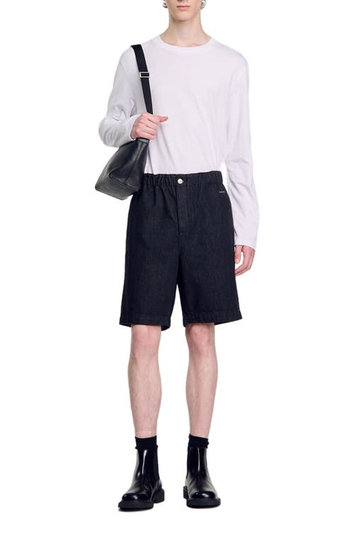 Shop Sandro Raw Denim Bermuda Shorts In Black