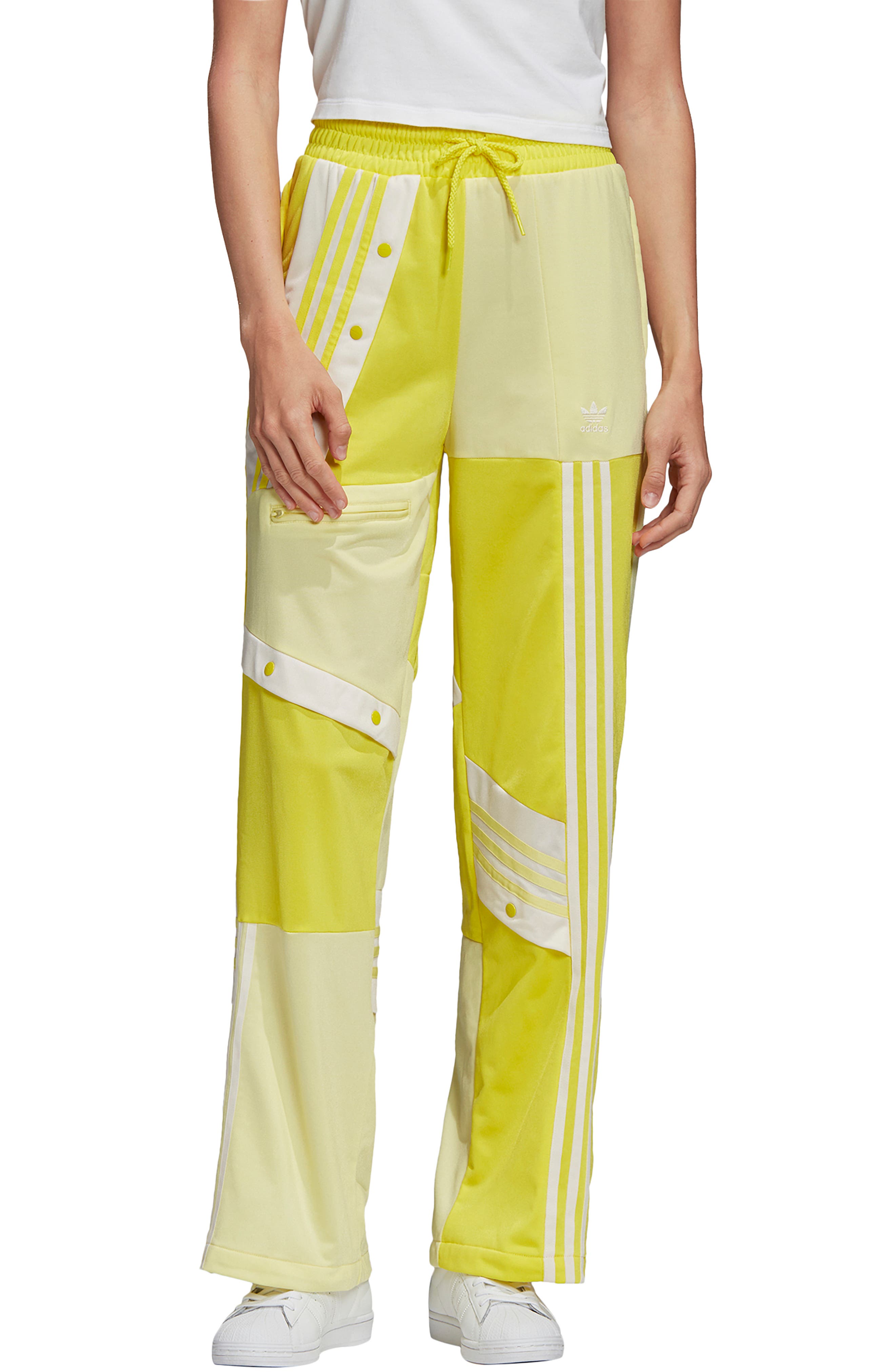 yellow adidas track pants