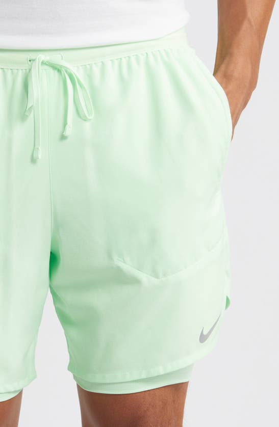 Shop Nike Dri-fit Stride 2-in-1 Running Shorts In Vapor Green/ Vapor Green