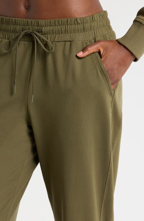 Shop Zella Move In Pocket Joggers In Olive Night