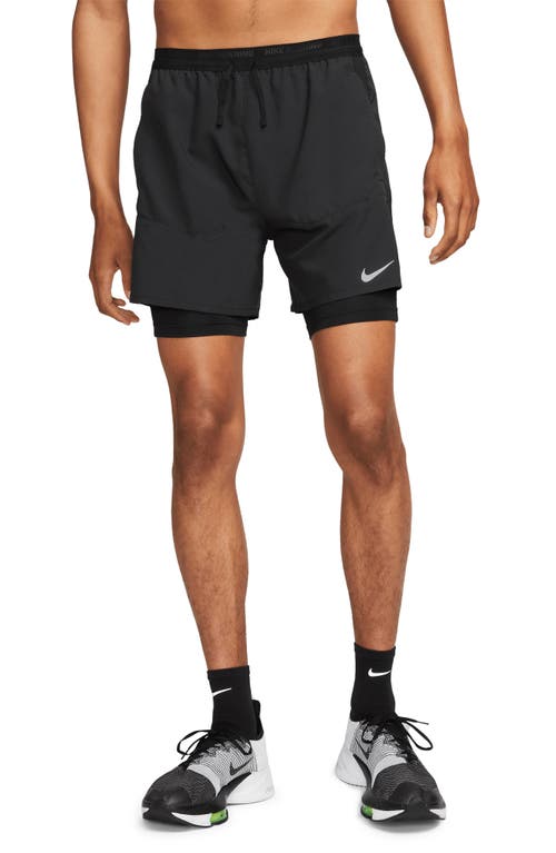 Shop Nike Dri-fit Stride Hybrid Running Shorts In Black/black/black