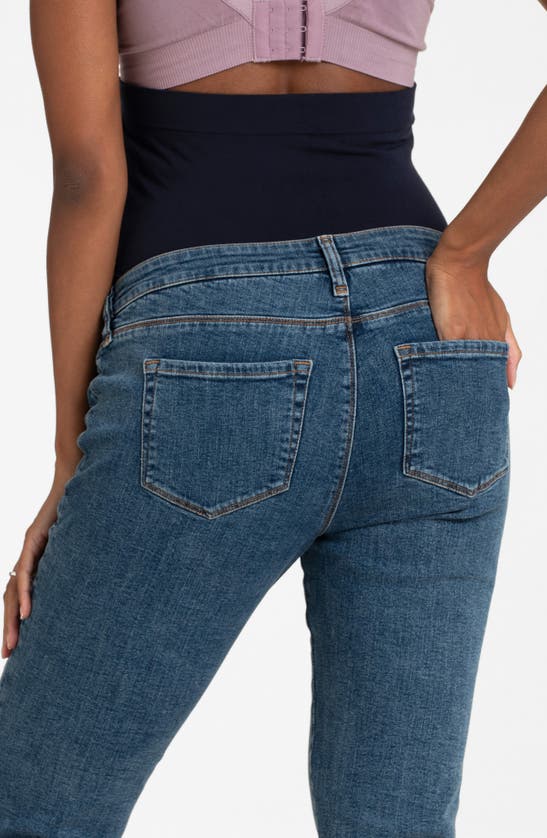 Shop Seraphine Over The Bump Slim Fit Maternity Jeans In Mid Blue