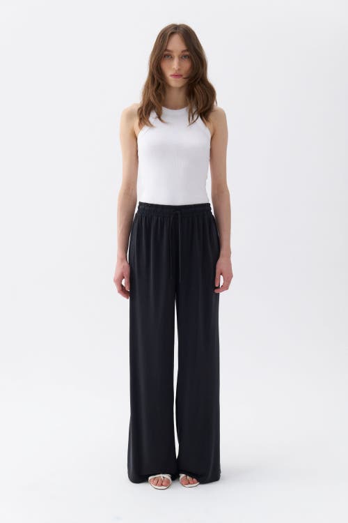 Shop Nocturne Loose Fit Wide Leg Pants In Black