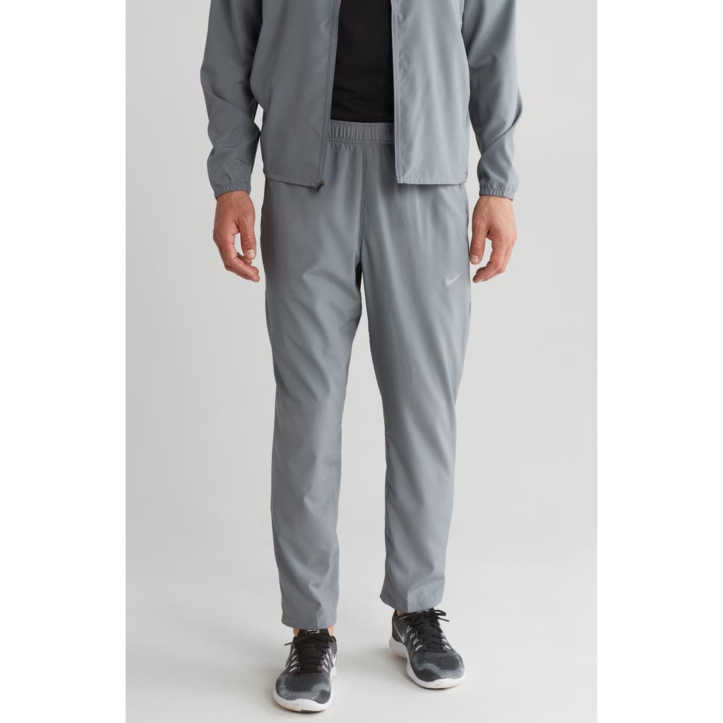 Shop Nike Form Dri-fit Versatile Pants In Smoke Grey/black/silver