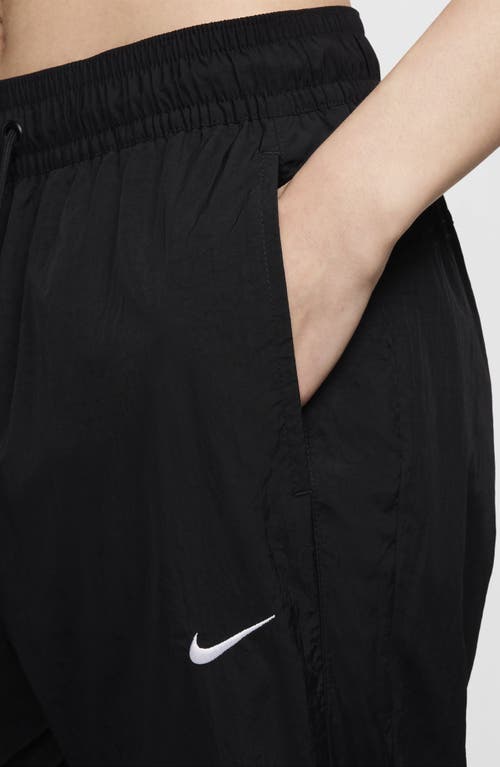 Shop Nike Sportswear Repel Zip Hem Pants In Black/white