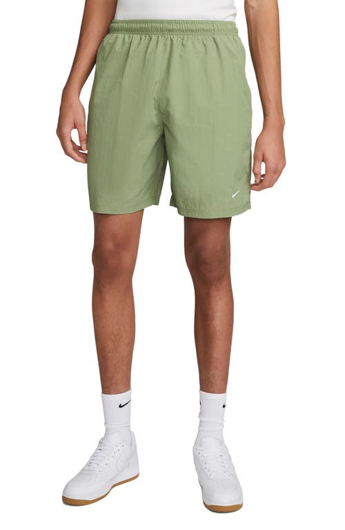 Nike Solo Swoosh Water Repellent Nylon Shorts Oil Green/White at Nordstrom,