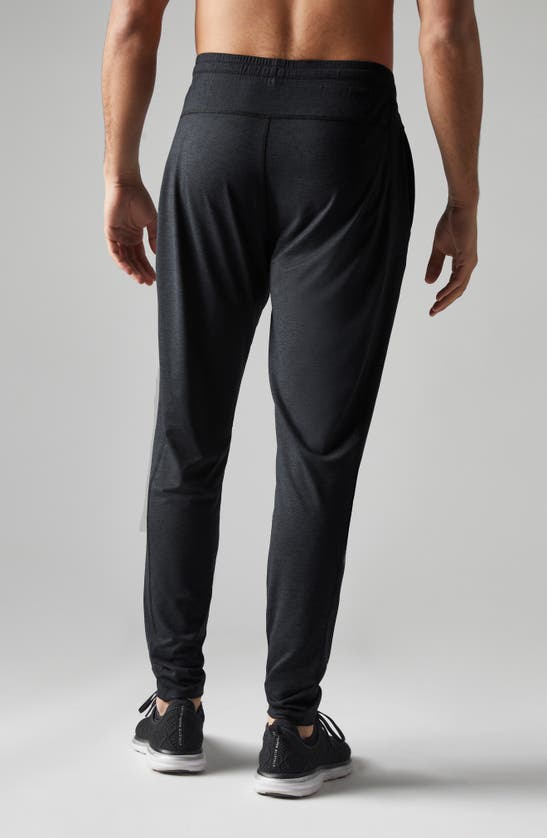 Shop Rhone Ooo Tapered Knit Pants In Black