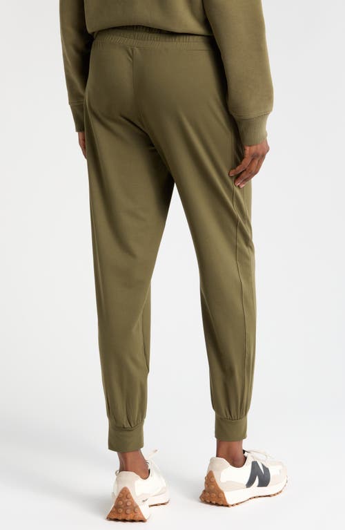 Shop Zella Move In Pocket Joggers In Olive Night