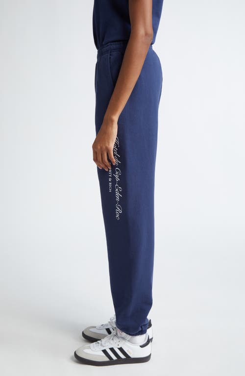 Shop Sporty And Rich Sporty & Rich Hotel Du Cap Cursive Cotton Sweatpants In Navy