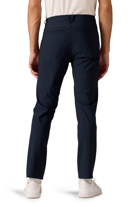 Shop Rhone Momentum Water Repellent Flat Front Golf Pants In True Navy