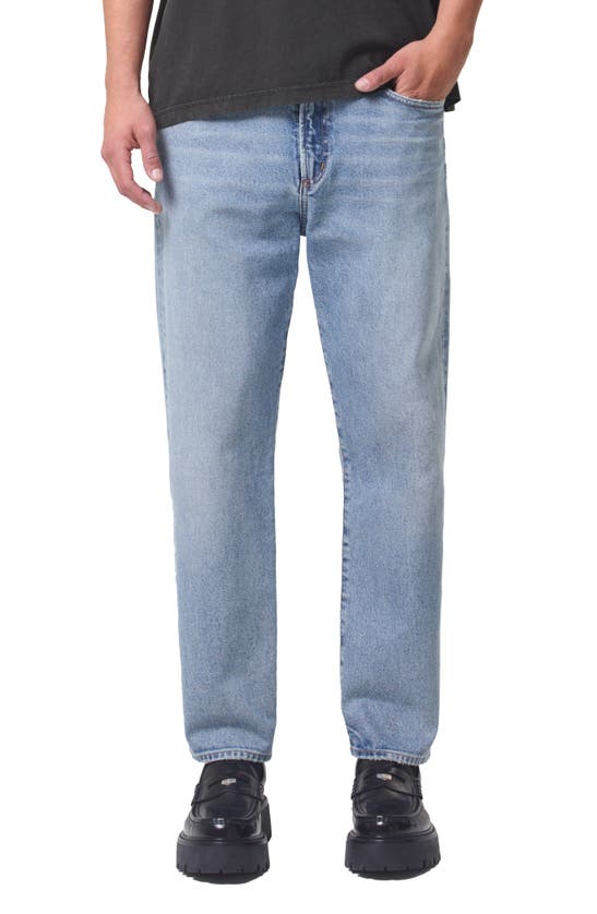 Shop Agolde Curtis Relaxed Tapered Jeans In Turmoil