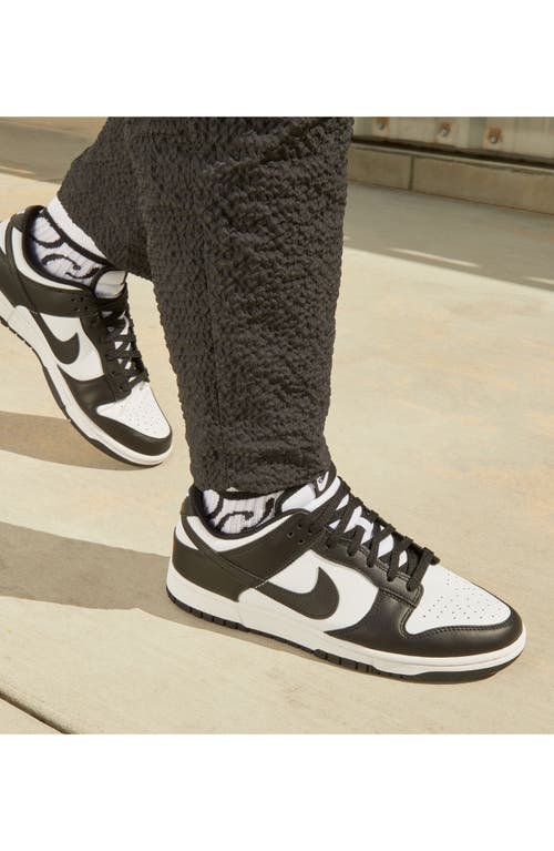 Shop Nike Dunk Low Retro Basketball Sneaker In White/black/white