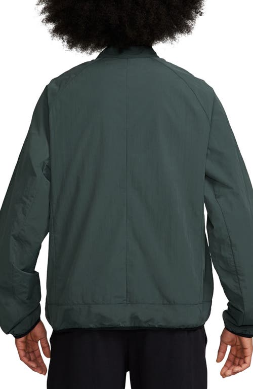 Shop Nike Tech Woven Jacket In Vintage Green/black