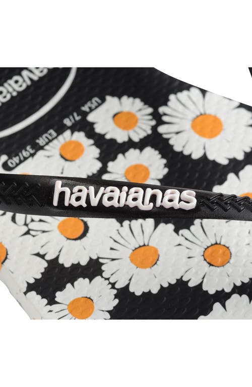 Shop Havaianas Slim Daisy Flip Flop In White/black