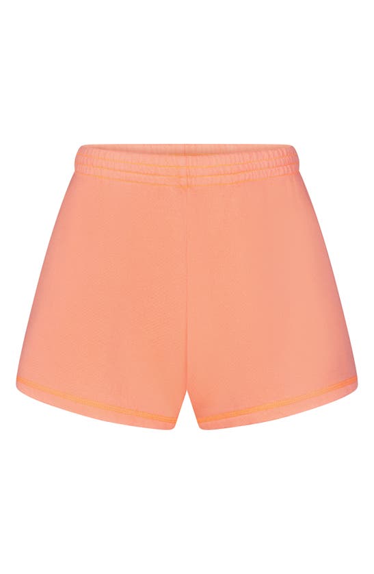 Shop Skims Light French Terry Loose Shorts In Neon Orange