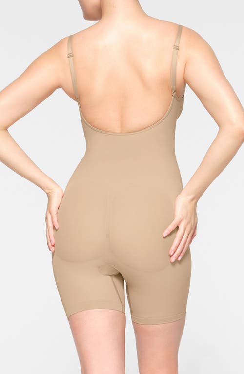 Shop Skims Seamless Sculpt Low Back Mid Thigh Bodysuit In Clay