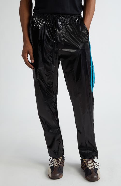 x Song for the Mute Shiny Track Pants in Black/Active Teal