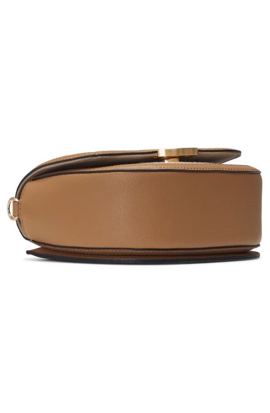 Oryany Lottie Saddle Canvas Crossbody Bag In Sand Brown