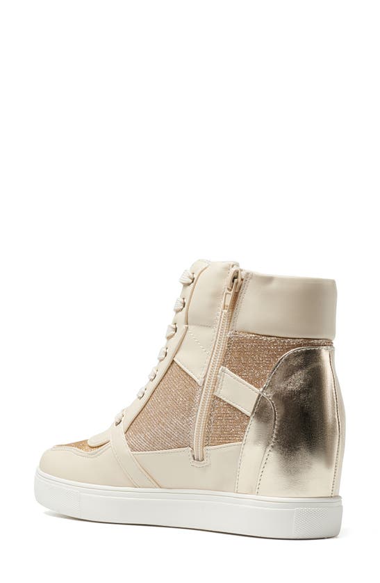 Shop Bcbgeneration Jansy Wedge Sneaker In Bianca-platino