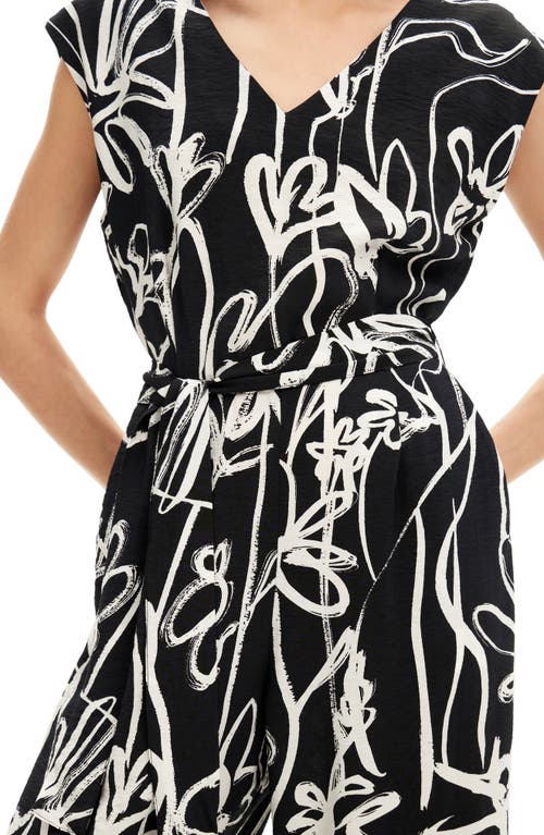Desigual Long Jumpsuit With Arty Flowers. In Black