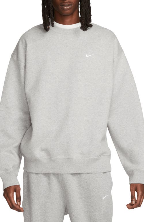 Shop Nike Solo Swoosh Oversize Crewneck Sweatshirt In Dark Grey Heather/white