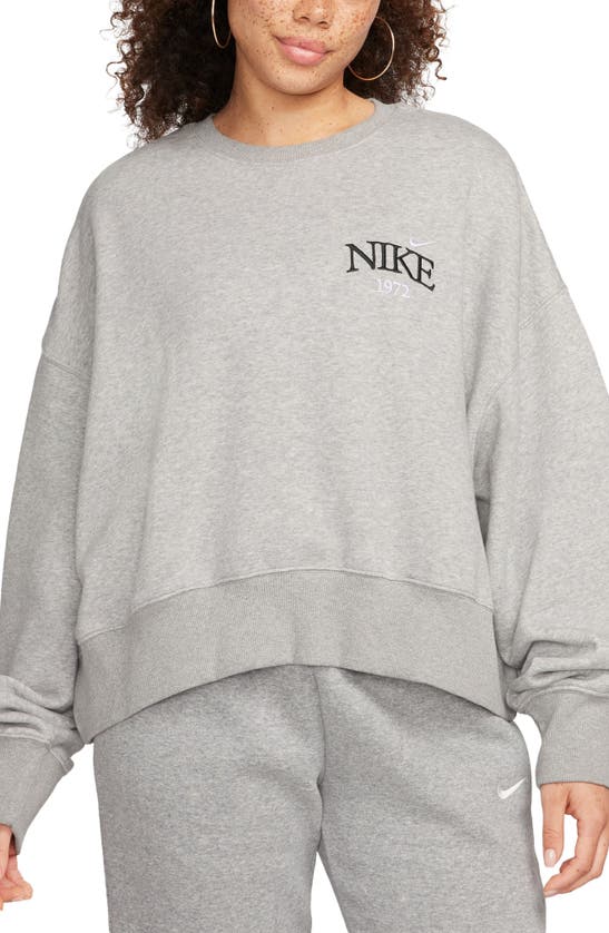 Shop Nike Phoenix Fleece Varsity Oversize Crewneck Sweatshirt In Dark Grey Heather