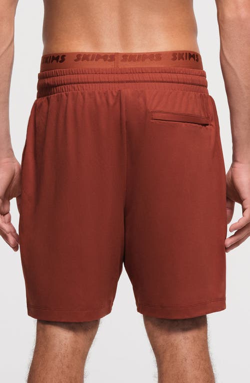 Shop Skims Outdoor Jersey Sweat Shorts In Rust