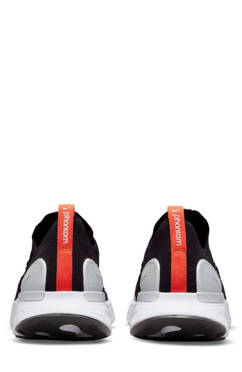 Shop Nike Gender Inclusive React Phantom Run Flyknit 2 Running Shoe In Black/white/orange