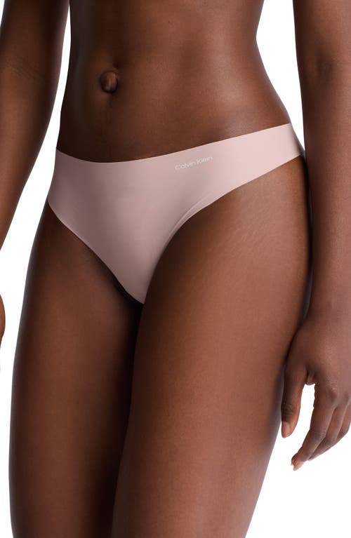 Shop Calvin Klein Invisibles 3-pack Thongs In Tqo Subdued