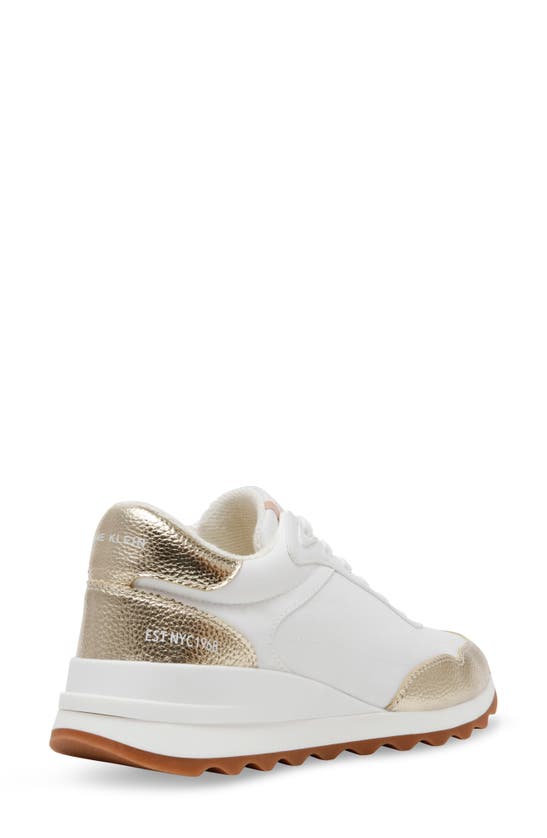 Shop Anne Klein Restless Wedge Sneaker In White Multi